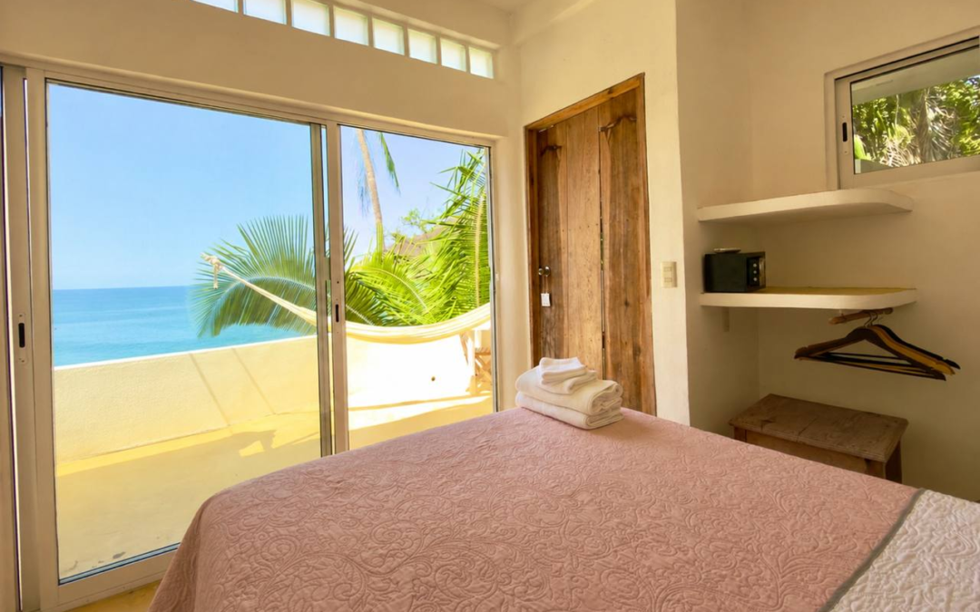 Room 18 – Air-Conditioned Ocean Queen bedroom with ocean-view terrace and hammock