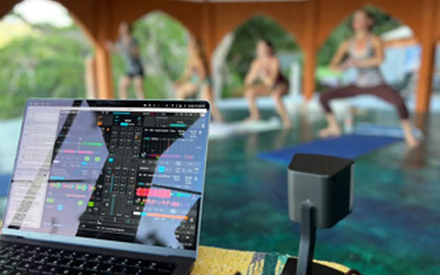 whats-included-live-dj-yoga-1440x900-1-perf-v1.webp DJ equipment beside a live yoga class at Pura Vida