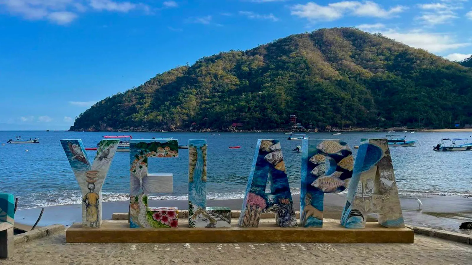 Welcome to Yelapa: Yoga, Joy & Ocean Magic Colorful Yelapa letters overlooking the bay and hillside.