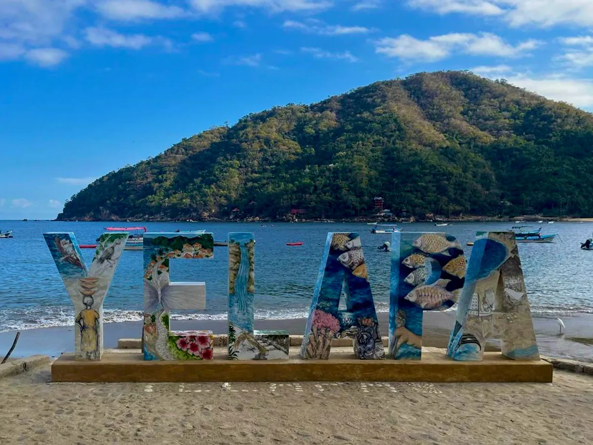 Welcome to Yelapa: Yoga, Joy & Ocean Magic Colorful Yelapa letters overlooking the bay and hillside.
