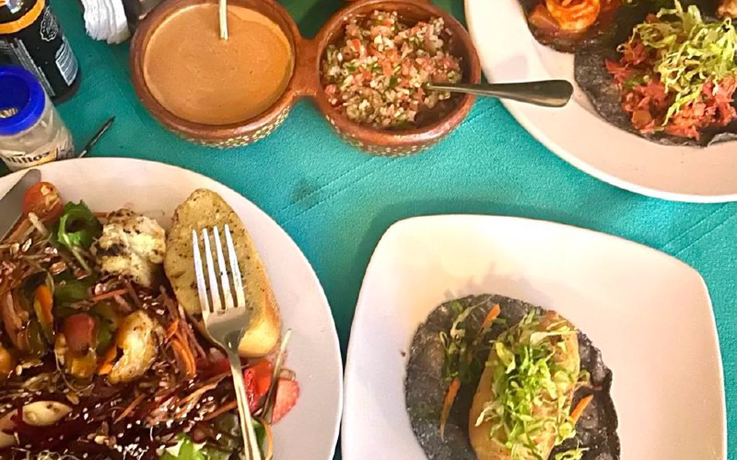 delicious-local-cuisine-card-popup-1440x900-perf-v1.webp A colorful selection of freshly prepared local cuisine
